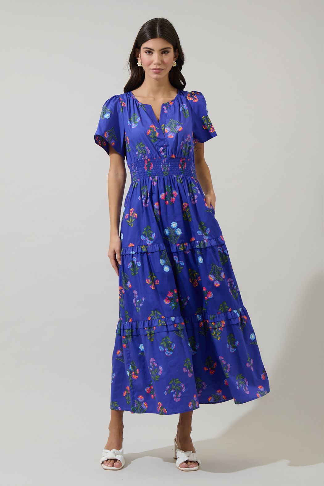 Woman wearing a blue floral dress