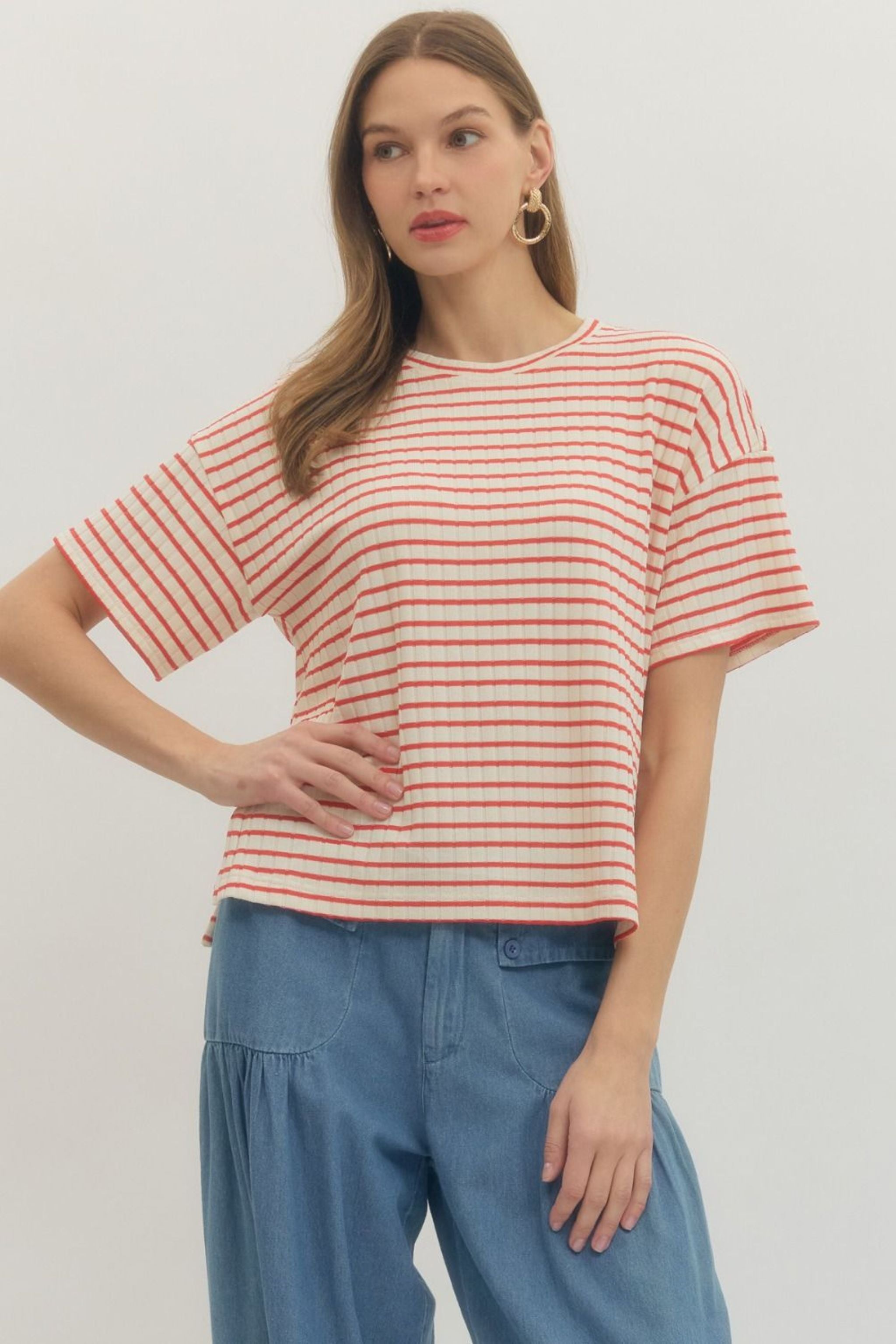 Woman wearing a red and white striped shirt