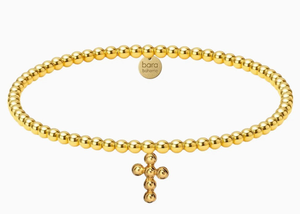 Gold beaded bracelet with a cross charm