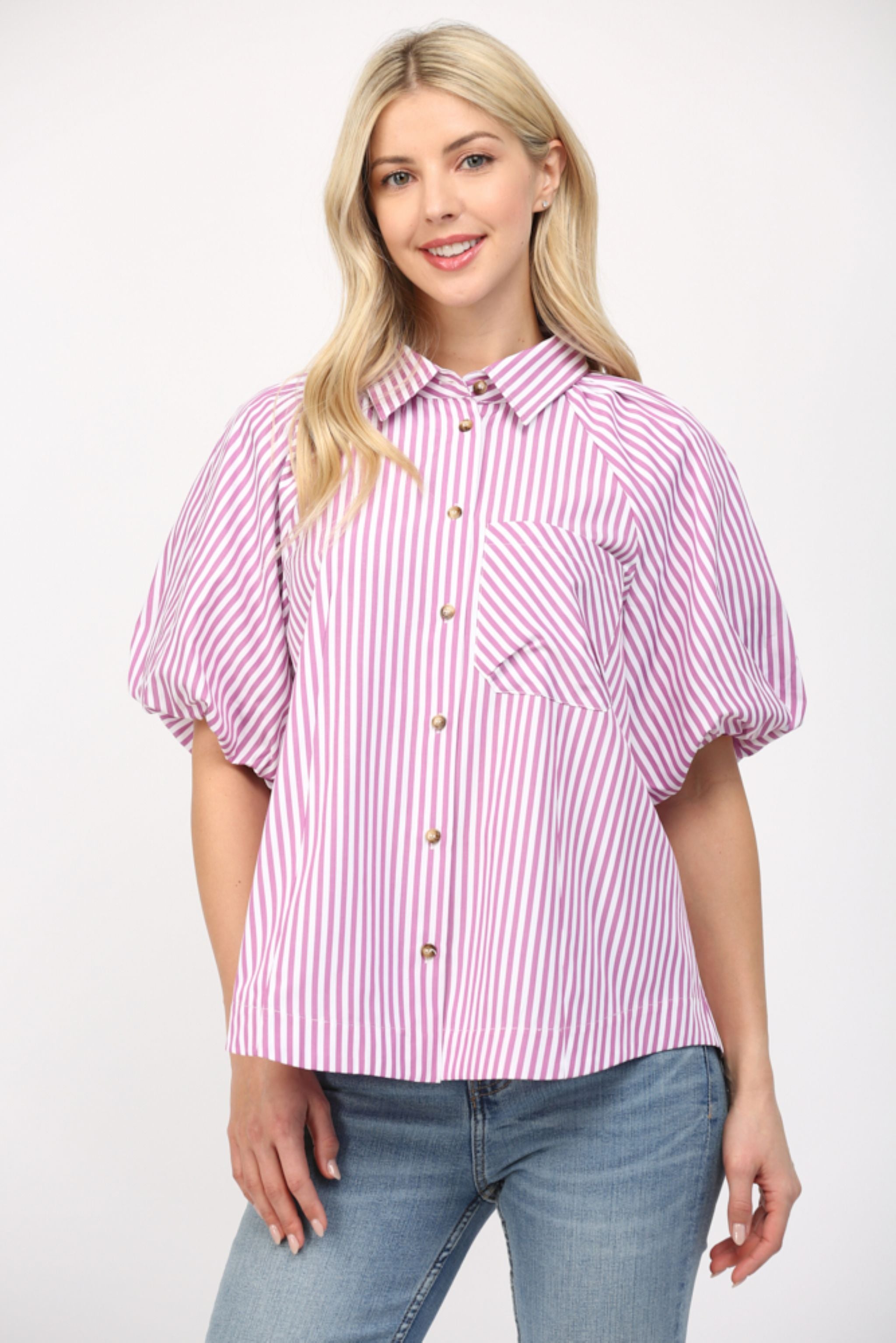 Woman wearing a pink and white striped shirt