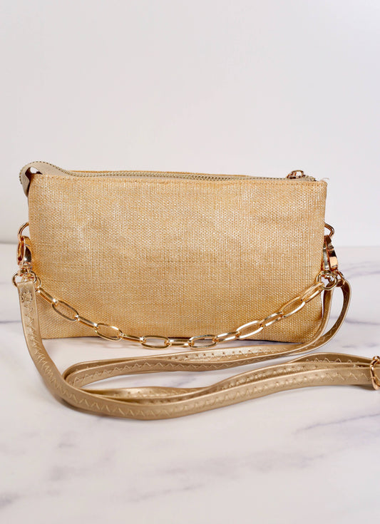 This crossbody is the perfect size! It has a removable chain accent that can be used as a carrying strap as well. 