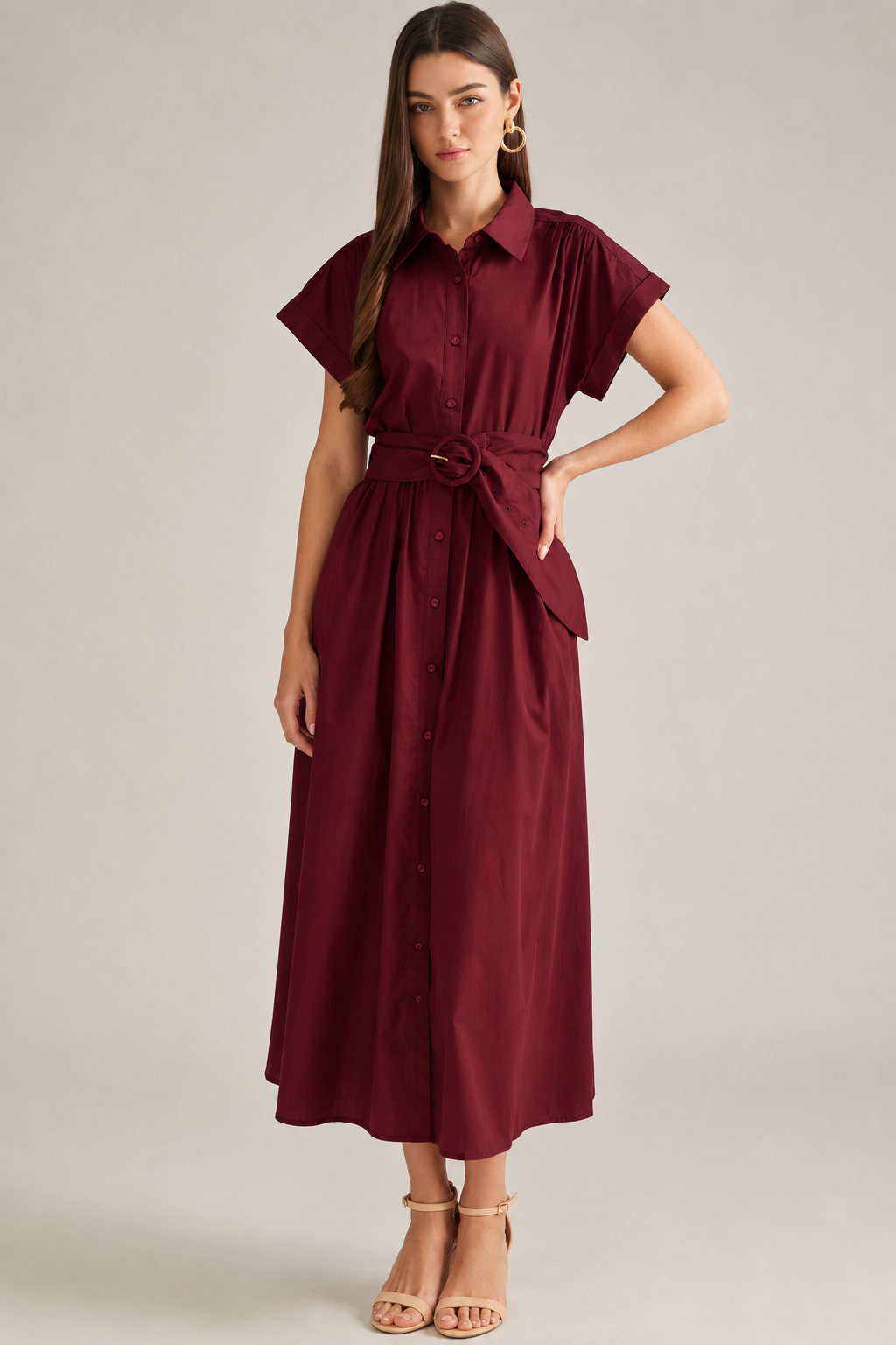 Model wearing a deep maroon belted shirt midi dress with a structured collar, flutter sleeves, button front, and gathered midi skirt