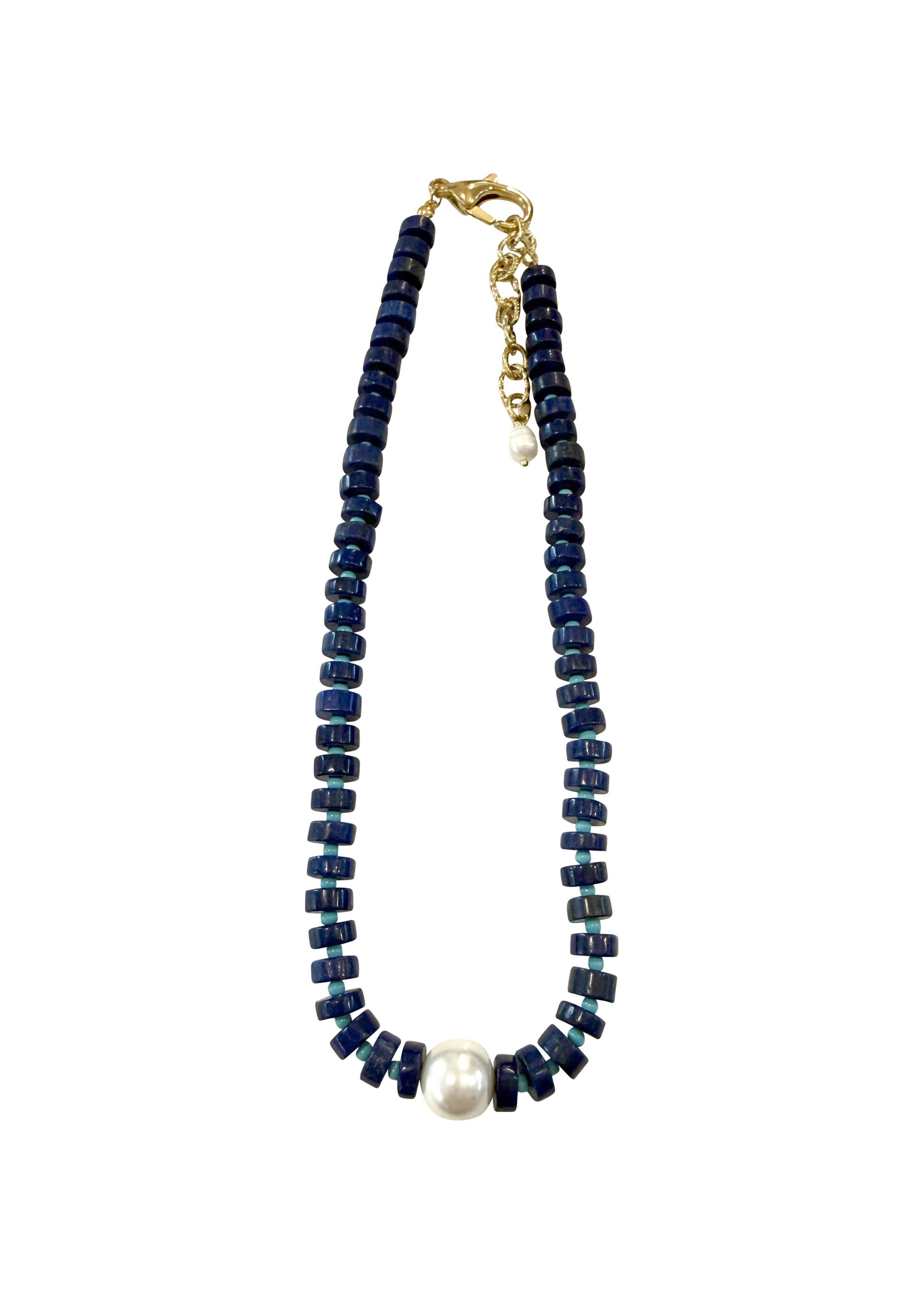 Necklace with blue beads and a white pearl