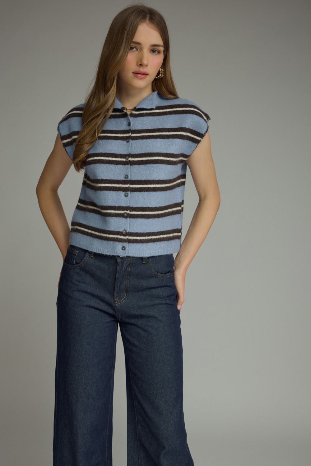 Light blue and brown horizontal striped cap sleeve top with button-front closure, cropped at natural waist, unlined knit construction.