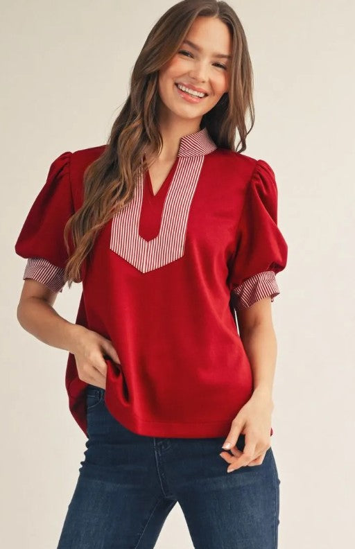 Maroon women's puff sleeve blouse with cream and brown striped V-neck bib
