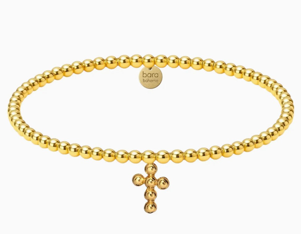 Gold beaded bracelet with a cross charm