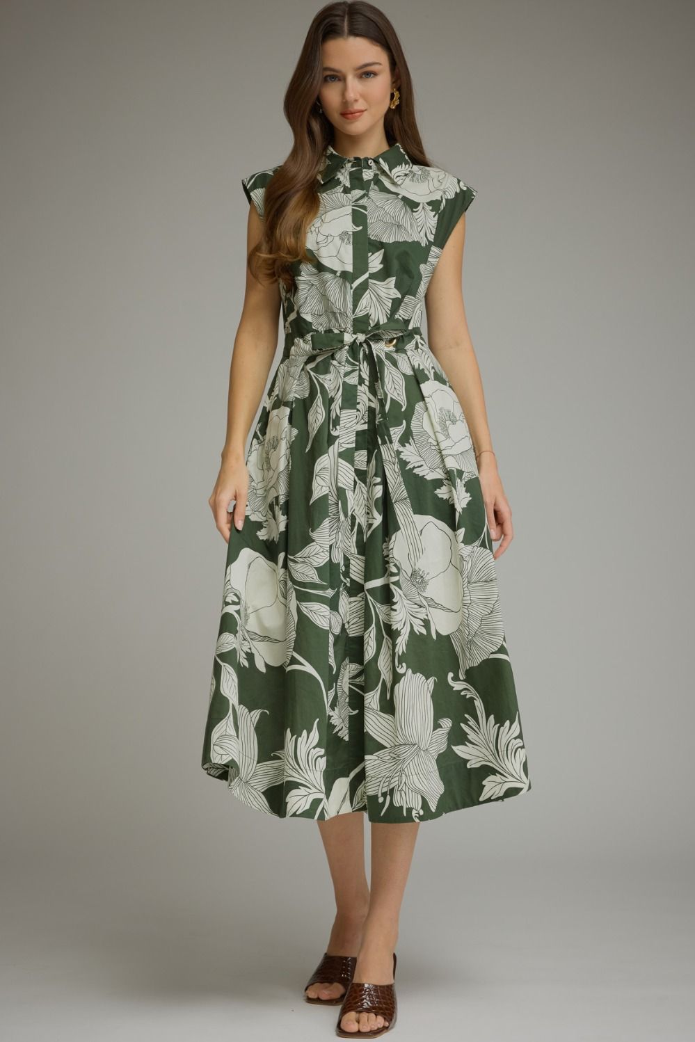 Floral sleeveless midi dress with button-front closure, self-tie belt at waist, functional side pockets, fully lined, hits below the knee.