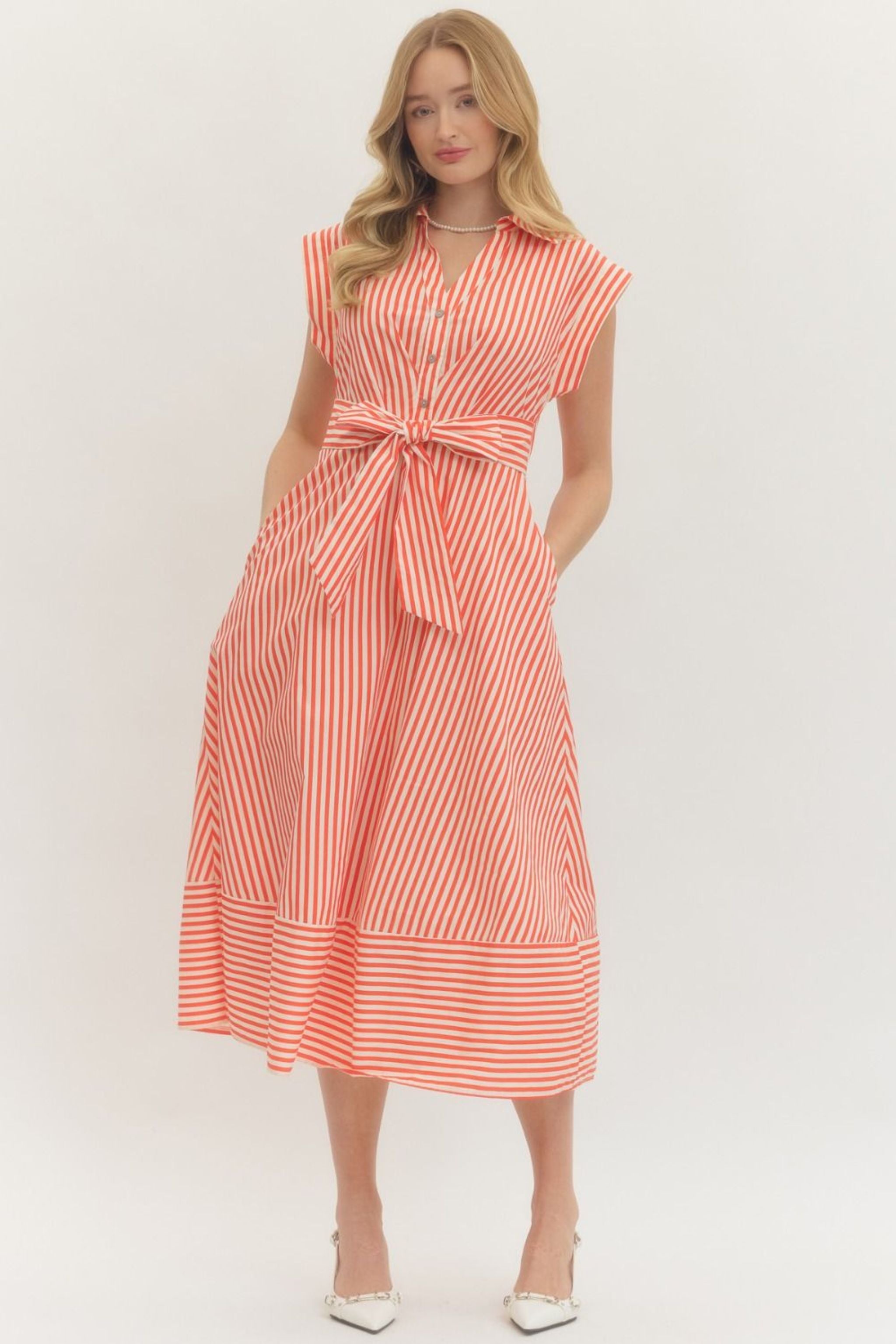 Woman wearing a red and white striped mindi dress