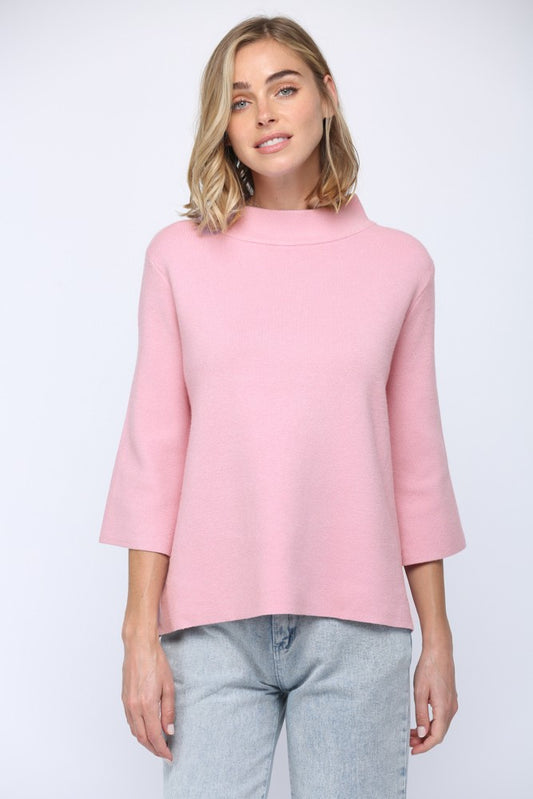 Mock neck pull over sweater with bell sleeve in baby pink. 
