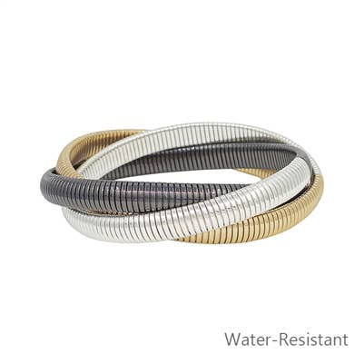 Tri-color bracelet with an elegant spiral design, perfect for adding a touch of sophistication to any outfit.