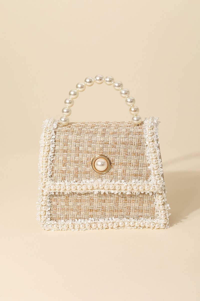 An absolutely gorgeous must-have hand bag that has a beautiful pearly studded woven hand bag design.
